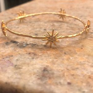 Gold toned starburst bracelet